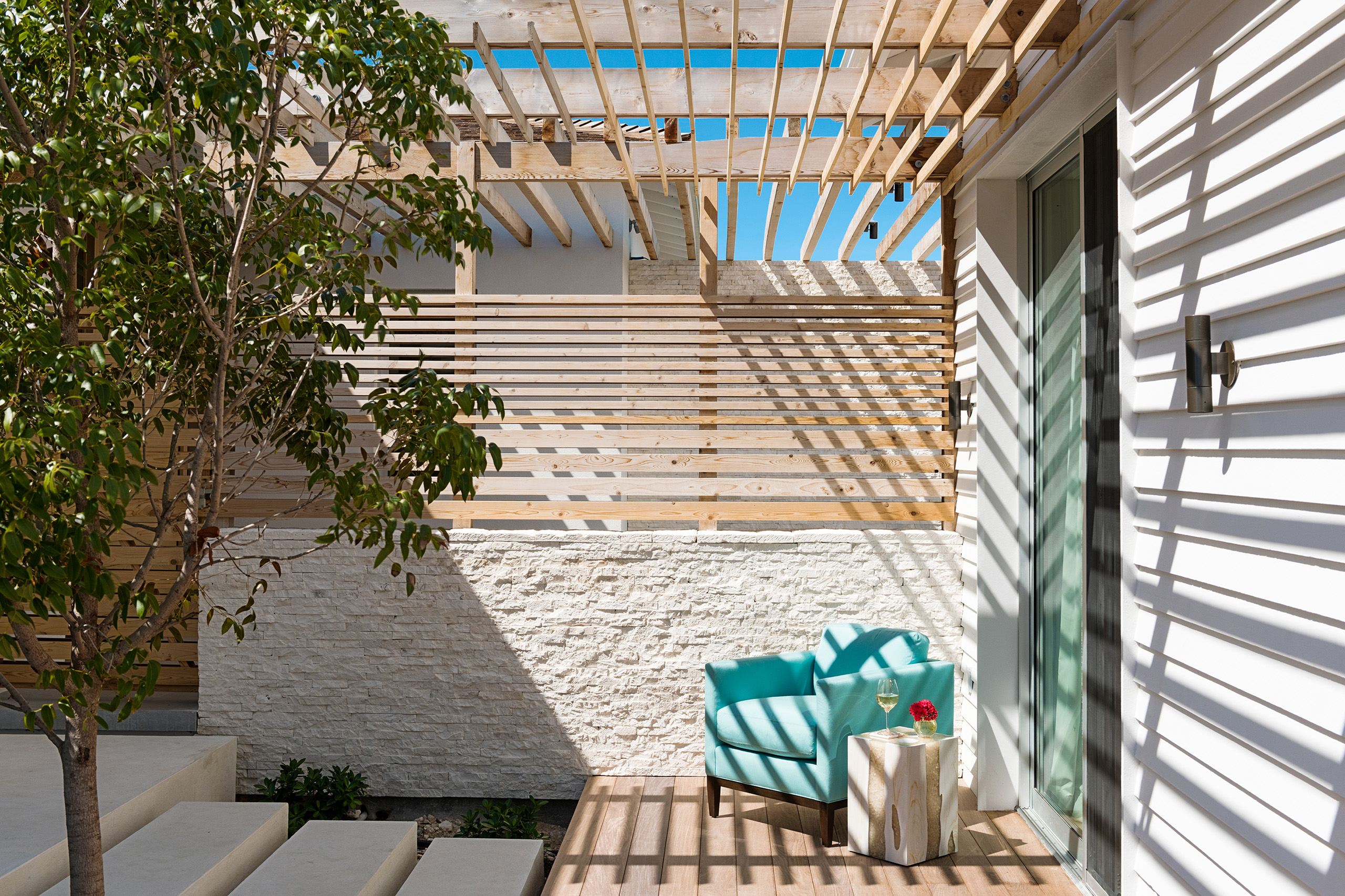 An intimate courtyard connecting the main living areas and the separate bedroom pod