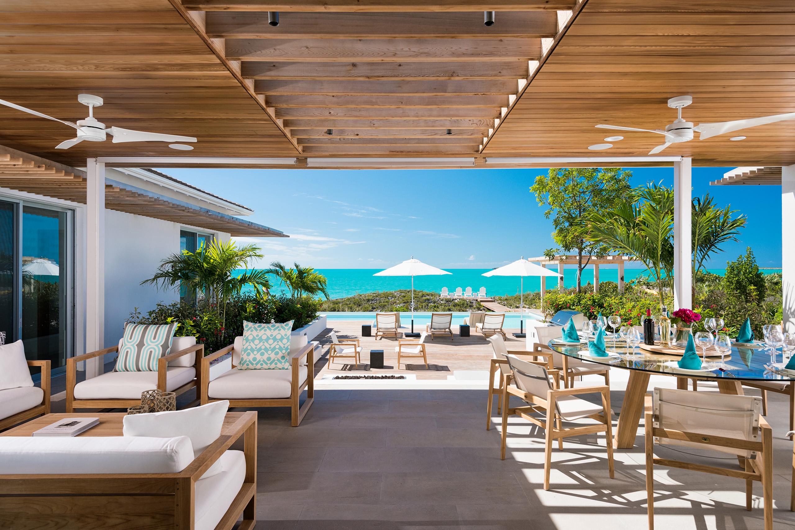 View of the pool terrace, with sheltered dining area