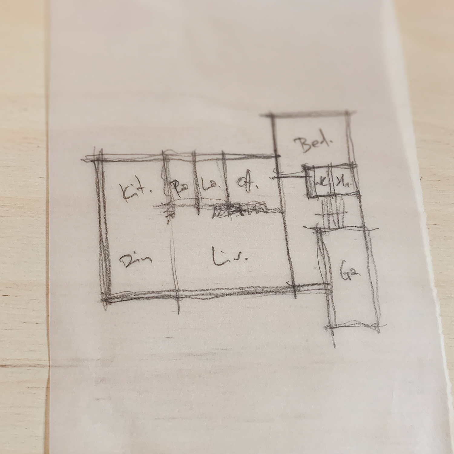 Pencil sketch floor plan showing early concept design for the Pembury extension, with rooms labelled including kitchen, dining, living, and garage